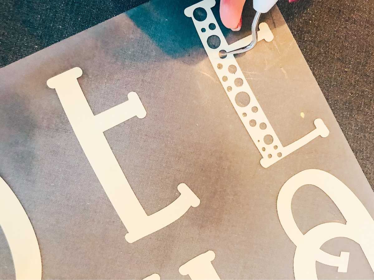 Weed thoroughly to remove all excess iron on vinyl