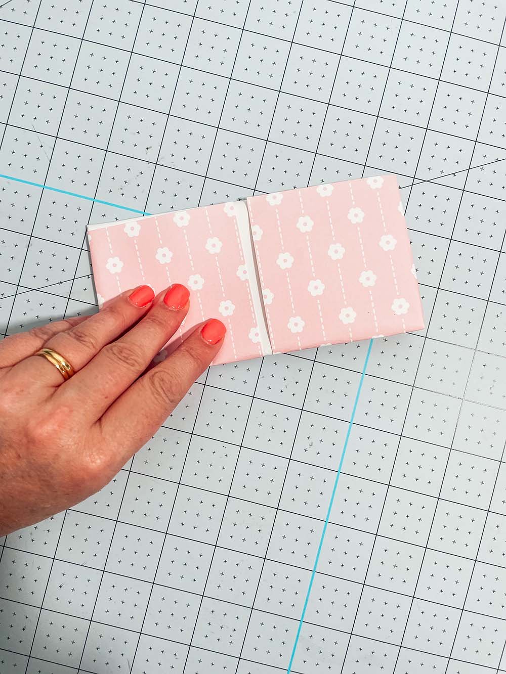 Fold in half in both dirrections to create a cross fold