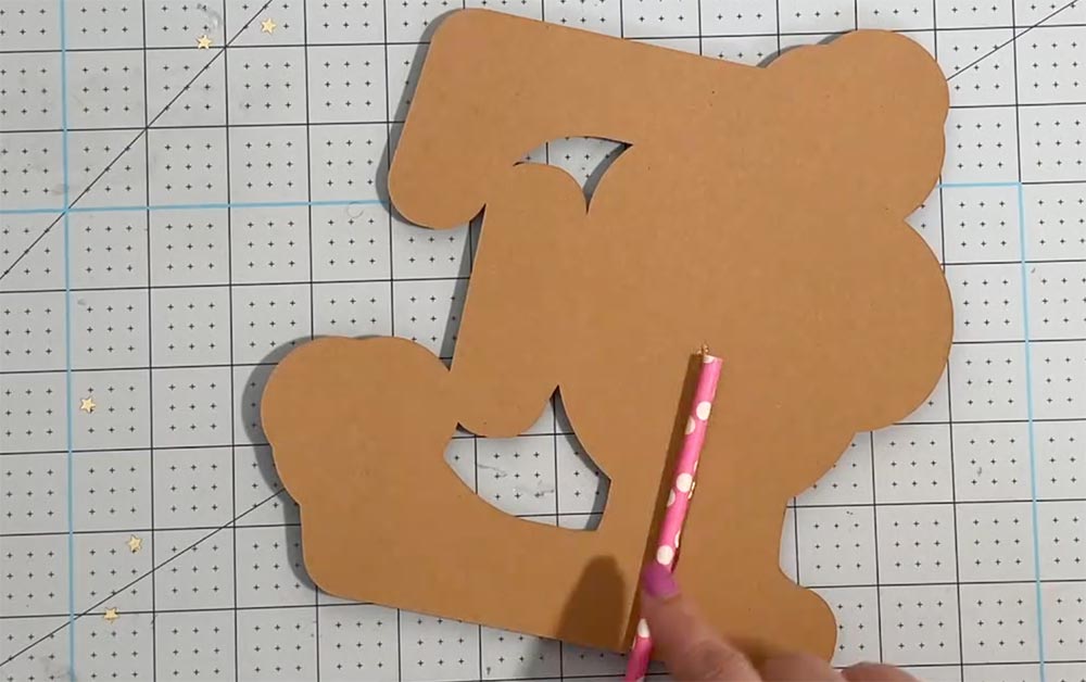 Glue a straw to the back