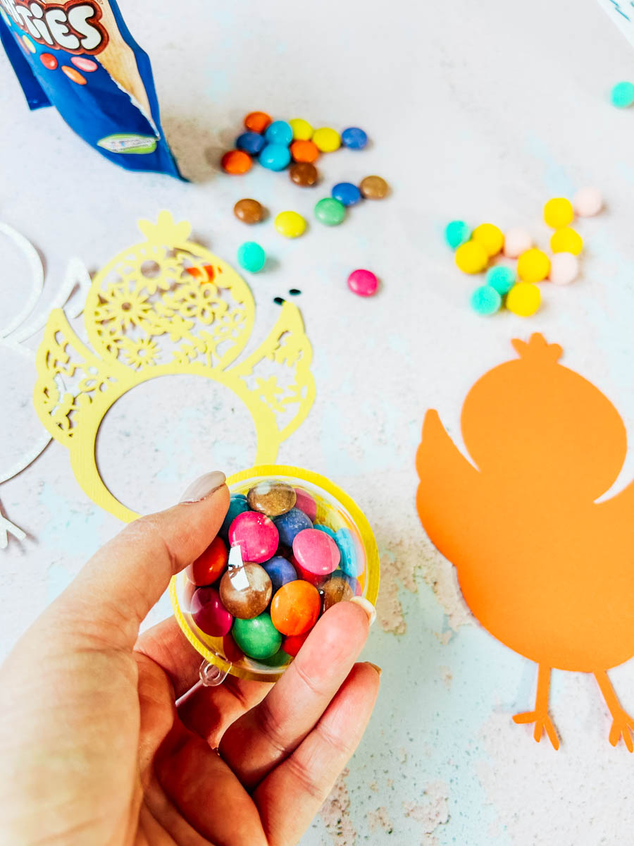 Pop the smarties into the bauble