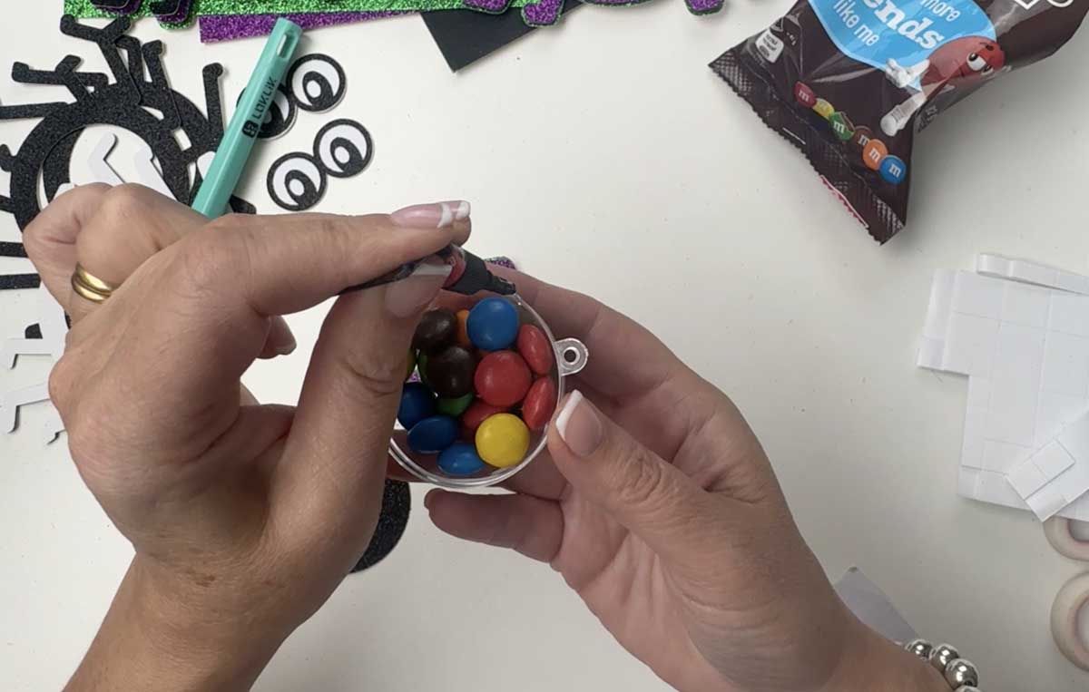 Add The Sweets to the baubles for your candy spider