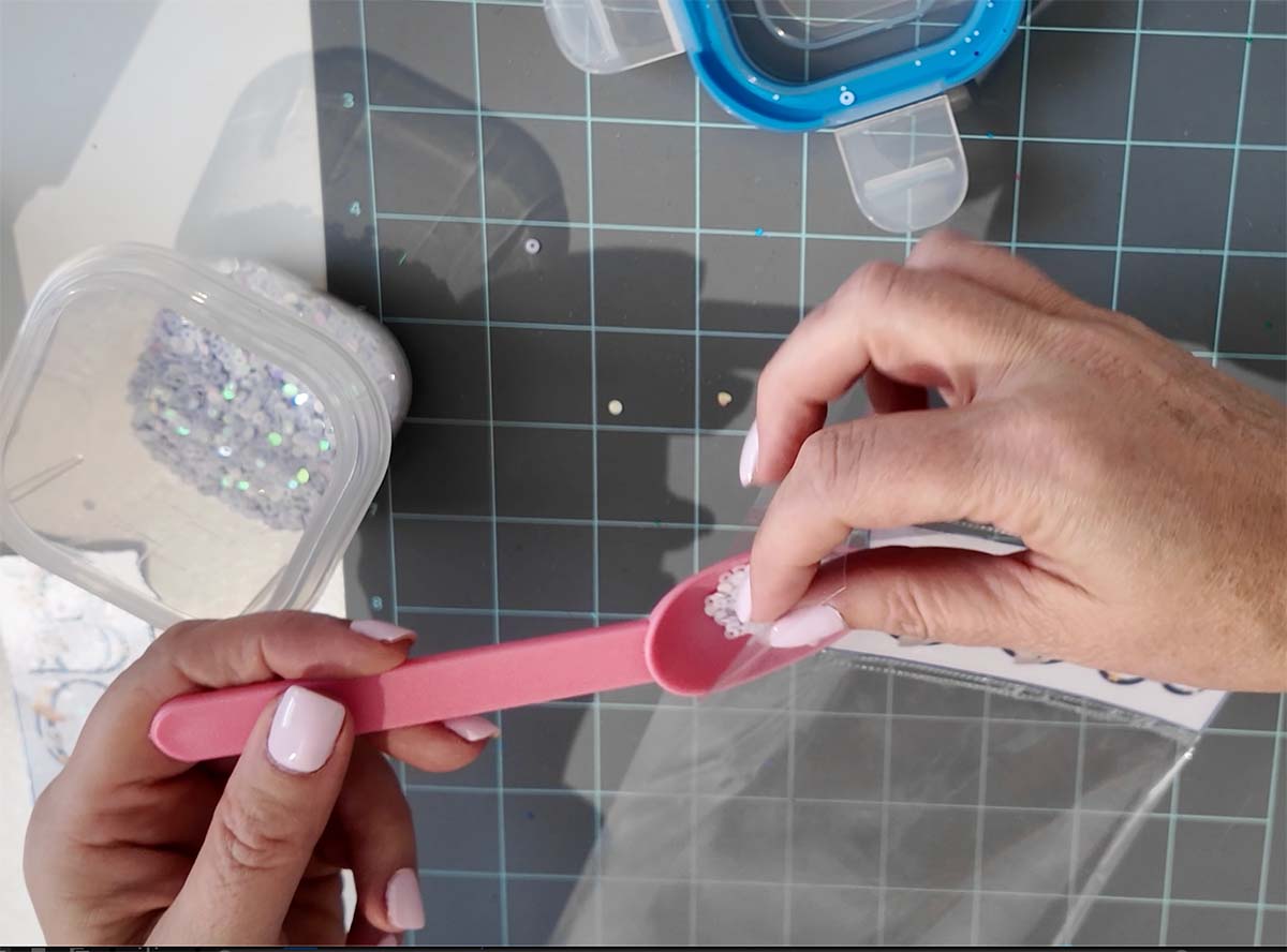 Pour sequins into the bookmark for the shaker element